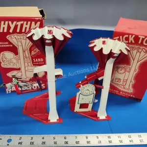 2 toy sand shovels Tick Tock and Rhythm