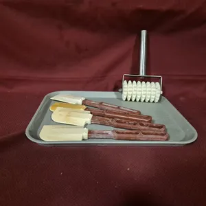(4) Vollrath 10" Silicone Scrapers, (1) Nylon 8 Wheel Roller Docker with Stainless Steel Handle