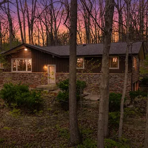 Private Wooded Home – With Four-Season Room, Fireplace & Finished Lower Level