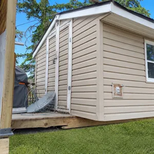 Shed Well Built 2X4 Construction 10'x10'x8' Hight On Skids double Front Door gray Siding & asphalt 