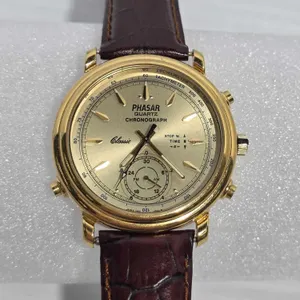 Classic Phaser Quartz Chronograph Watch. V601-0060 AD. I could not get the hands to move manually to change the time. Did not test further. Needs batt