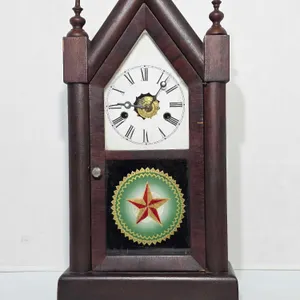 New Haven American Steepel Clock. Winds and Ticks but i could not get it to Chime. Has Some damage. 10.5 x 4.5 x 20. B3