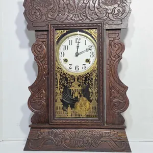 1909 Waterbury (as per a note) Gingerbread Mantel Clock with Floral Motif. Winds, Ticks and Chimes. No key. 15 x 4.5 x 23. B3