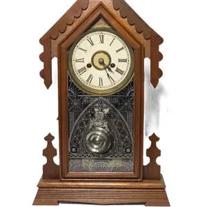 Ansonia Gingerbread Mantel Clock. Africa Strike. Winds, Ticks and has Clear Chime . 12.5 x 4 x 21. One pieve of the frame came unglued. Reserve Only $