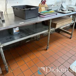 STAINLESS STEEL TABLE WITH LOWER SHELF ON CASTERS