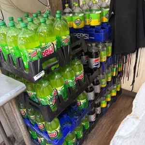 LARGE LOT OF BOTTLED MOUNTAIN DEW & STARRY