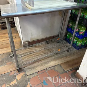 STAINLESS STEEL TABLE WITH LOWER SHELF ON CASTERS