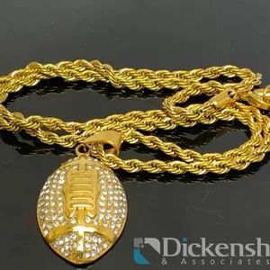 Gold Tone Necklace With Football Shape Pendant