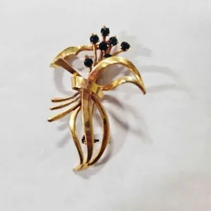 Gold tone Brooch w/Green rhinestones