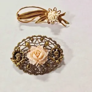 2 gold tone Brooches-both have carved roses
