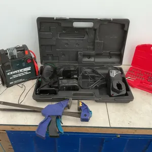 Hitachi cordless flashlight and battery booster pack - condition unknown, 2 quick clamps, miscellane