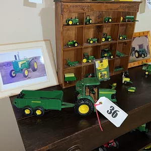 LARGE SELECTION OF JD TOYS AND MEMORABILLIA - INCLUDES SMALL DISPLAY SHELF - TABLE NOT INCLUDED