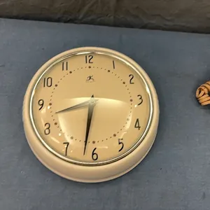 Wall clock and rotary desk phone