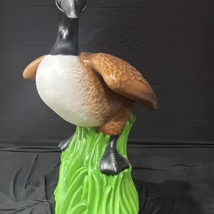 A Canada Goose Display Sculpture. Mounted on a green stylized grass base. Original Master Sculpture from the Goose Statue event presented by the Roche
