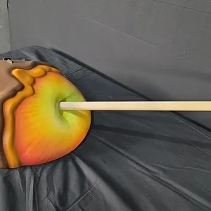 A Caramel Apple on a Stick Raised Relief Wall Sculpture. A wall sculpture featuring a caramel apple with chocolate sprinkles on a stick. Originally de