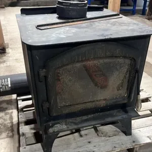 Iron Wood Stove. 26" x 24" x 27"H w/Pipe.