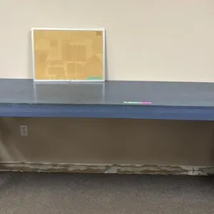 Wooden Table and Newspaper Stand and Bulletin