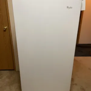 Whirlpool upright freezer, 60 inches tall, 30 inches wide, 29 1/2 inches deep, is running and working