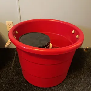Plastic tub with rope handles, and seasonal tins