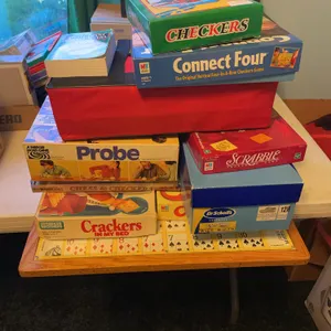 Assortment of games; connect four, Scrabble, probe, crackers in my bed, operation,