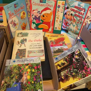 Winnie the Pooh play a sound book, Disney play a sound book, Tractor Mac books, three floral patterned puzzles, children’s Bible stories book