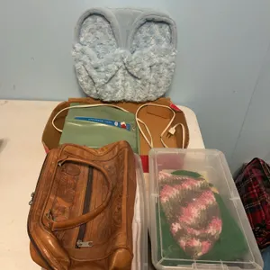 Dr. Scholl’s foot, massager, foot warmer, crochet sock, hats, leather purse, and two small plastic totes