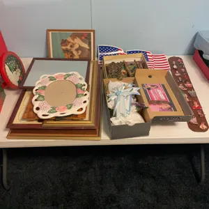 Various picture frames, wall mounted candle holders, decorative items, magnetic American flags