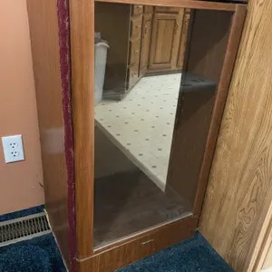 Wood display cabinet, glass door, 21 inches wide 16 inches deep 35 inches tall