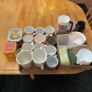 Coffee, cups, small tins, measuring cups, plastic storage container