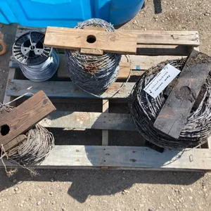 (3) Rolls of Barb Wire, (1) Roll of Slick Wire