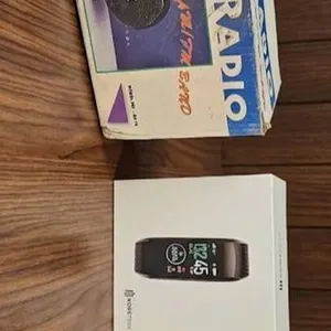 Three Electronic Items: Portable Radio, Fitness Tracker, and Keychain Echo Device