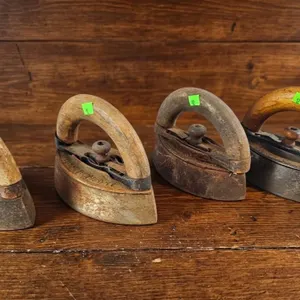 Four Vintage Cast Iron Hand Irons with Wooden Handles
