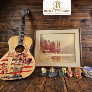 Lot Featuring Acoustic Guitar, Framed Lake Scene Print, Ceramic Figures, and Decorative Mug