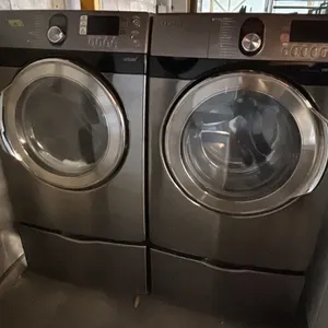 SAMSUNG STEAM FRONT LOAD WASHER & DRYER SET ON PEDESTAL BASES