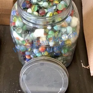 VINTAGE GLASS MARBLES IN ANTIQUE COFFEE JAR