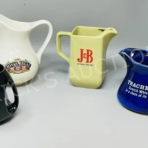 4 whisky water jugs w/ advertising - 2 are Wade