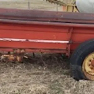 New Holland 328 single axle manure spreader.