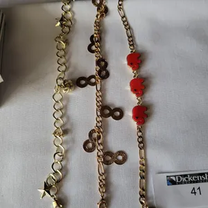 LOT WITH (3) GOLD TONE BRACELETS