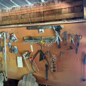Contents of Wall. Pipe Bender, Squares, Tools etc
