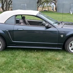 1999 Ford mustang convertible, car is green with white vinyl top, 140,000 miles, V8 automatic, pictures coming soon