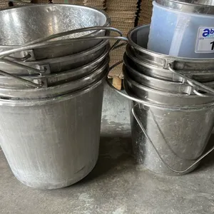 STACK OF METAL BUCKETS AND 1 PLASTIC VESSEL. APPROX 11 PIECES