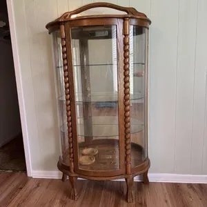 Curved glass curio cabinet.