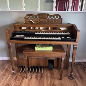 Electronic organ with stool.