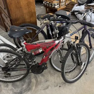 Three bicycles. Two mountain bikes. One road bike.