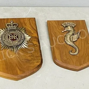 pair of Military insignia mounted wall plaques