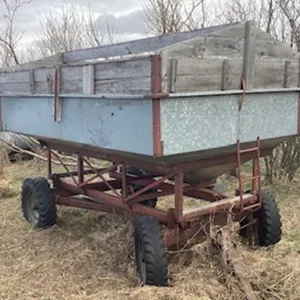 Approx 100 bushel Farmec hopper box on wagon