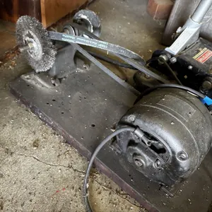 Wire wheel and buffer mounted on board