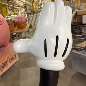 A Mickey Mouse Right Hand Sculpture.  A sculpture of part of  Mickey’s right arm and right hand.  Constructed in polyurethane resin.  Measuring 17” x 