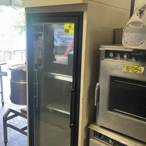 Hussmann HGL-1-TS single glass door reach-in freezer. Features self-contained refrigeration. Dimensions: 29"x33"x84". S/N: 08A00215-152. Note: Interio