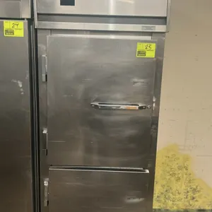 Continental DL1FE-SA-HD reach-in freezer. Features stainless steel construction, 2 solid half-doors, and adjustable wire shelving. Self-contained refr
